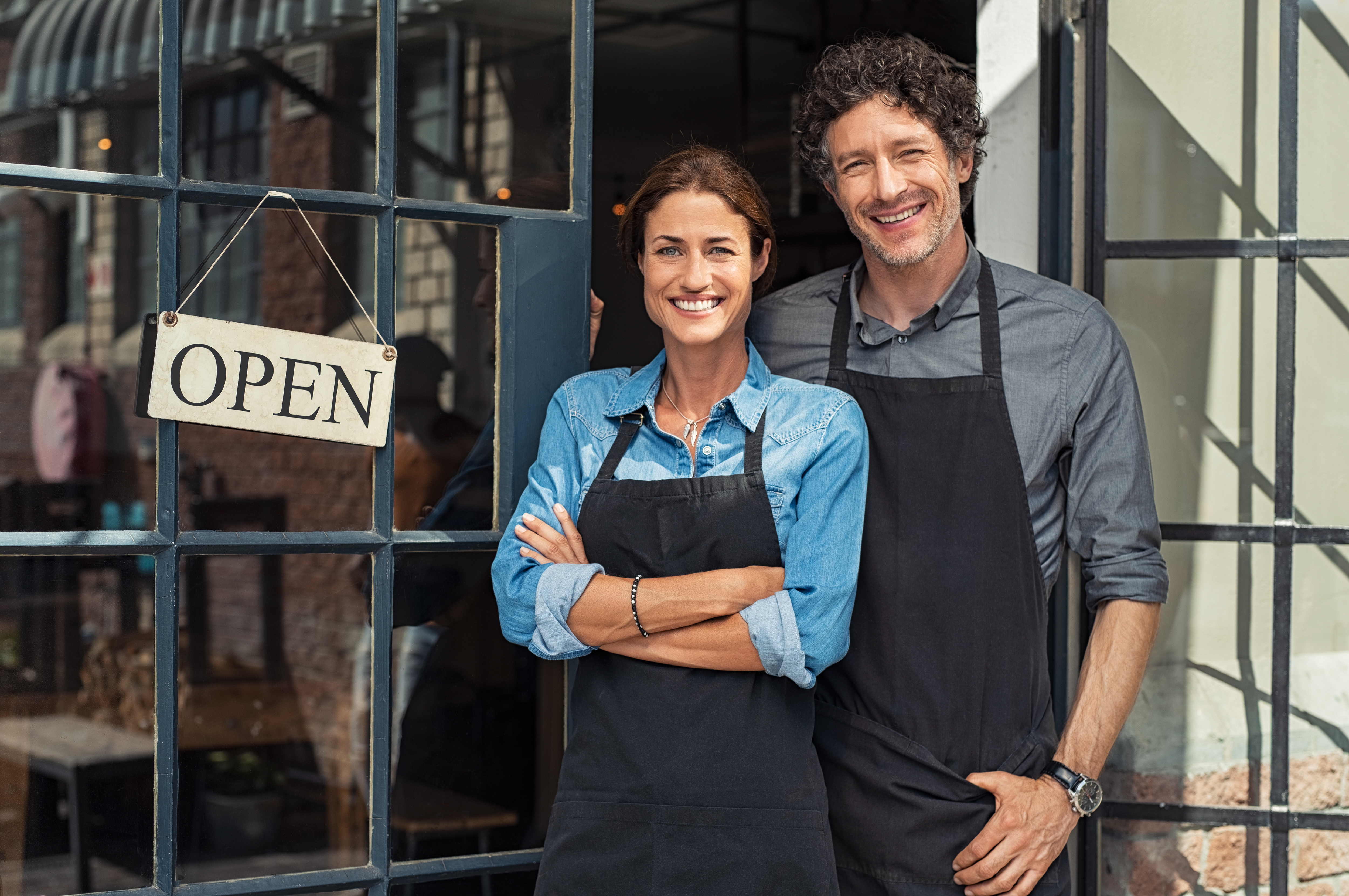 A couple in front of their Small Business