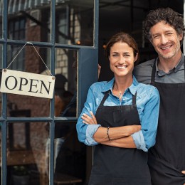 A couple in front of their small business