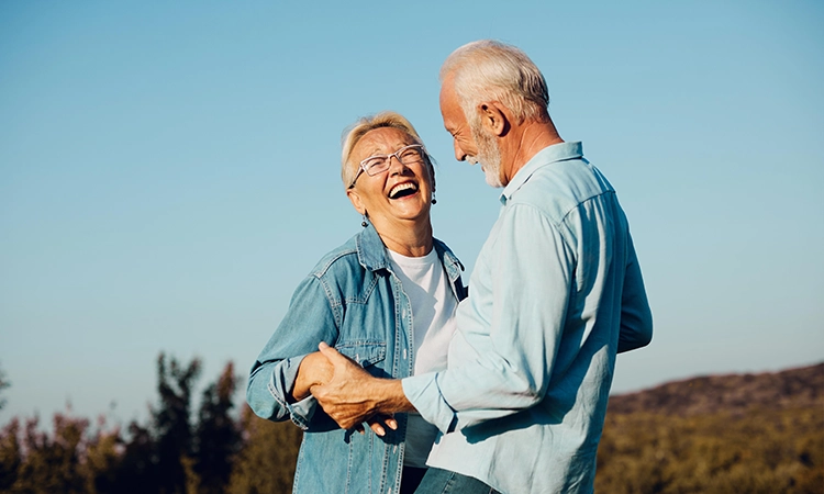 happy retired couple outdoors