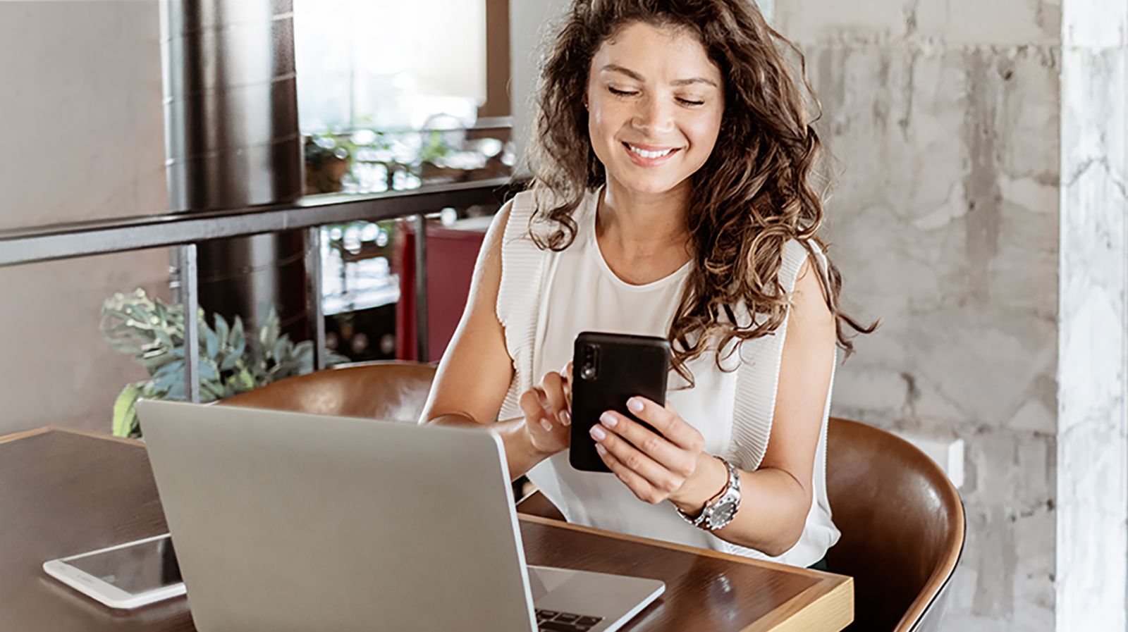 woman on a phone smiling